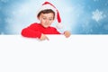 Christmas child kid boy Santa Claus pointing finger empty banner sign copyspace Royalty Free Stock Photo
