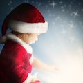 Christmas Child Open Gift on Background with Sparkle and Glitter Royalty Free Stock Photo