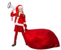 Christmas Child pulling Santa Bag Full of Gifts. Funny Little Girl in Santa Hat and Costume with Red Huge Sack with Xmas Presents Royalty Free Stock Photo