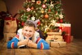 Christmas Child under Xmas Tree, Happy Boy Presents Gifts Royalty Free Stock Photo