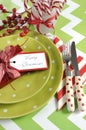 Christmas children family party table place settings in lime green, red and white Royalty Free Stock Photo