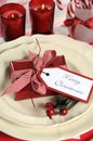 Christmas children family party table place settings in red and white Royalty Free Stock Photo