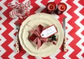 Christmas children family party table place settings in red and white theme Royalty Free Stock Photo