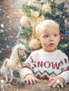 Christmas childs in snow. Happy child with christmas gift box. Cheerful cute child opening a Christmas present. Cute