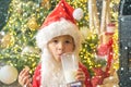 Christmas childs in snow. Happy kids Santa Claus with glass of milk and cookie. Santa Claus eating cookies and drinking Royalty Free Stock Photo