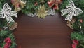 Christmas chocolate brown wooden background with glittery decors and lights