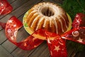 Christmas chocolate bundt cake with glaze decorated. Winter baking at Christmas or New Year with decorations on dark background Royalty Free Stock Photo