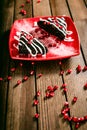 Christmas chocolate cake dessert with pomegranate on wooden table Royalty Free Stock Photo