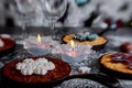 Christmas chocolate cookies with New Year& x27;s festive a candle decorations on the table Royalty Free Stock Photo