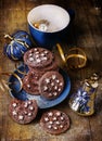 Christmas chocolate cookies over wooden background
