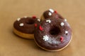 Christmas chocolate donuts decorated red and white sprinkles, selective focus Royalty Free Stock Photo