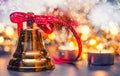 Christmas. Christmas bell with red ribbon candles and snowy background. Happy christmas text