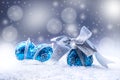 Christmas. Christmas blue balls and silver ribbon snow and space abstract background. Royalty Free Stock Photo