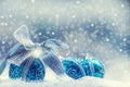 Christmas. Christmas blue balls and silver ribbon snow and space abstract background. Royalty Free Stock Photo