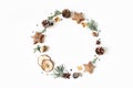 Christmas circle floral composition. Wreath of cypress branches, pine cones, anise, confetti stars, dry apples and