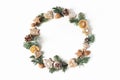 Christmas circle floral composition. Wreath of fir tree branches, pine cones, gingerbread cookies and dry orange slices