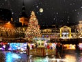 Christmas  the city  holiday New year night  light  and snowflakes fall  in Tallinn old town square Christmas tree decoration Royalty Free Stock Photo