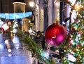 Christmas in the city  holiday New year  evening light  and snowflakes fall  in Tallinn old town square Christmas tree decoration Royalty Free Stock Photo