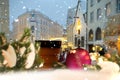 Christmas city ,pine tree   decoration  ,red ball ,ceramic cup of coffe , lantern candle blur light in  snowy  festive street  ,T Royalty Free Stock Photo