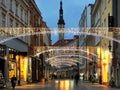 Christmas city street medieval houses holiday decoration city light lamp blurred in shop windows street green tree decorati