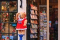 Christmas cityscape - view of a teddy bear dressed as santa blowing soap bubbles in front of a souvenir shop, Amsterdam Royalty Free Stock Photo