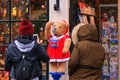 Christmas cityscape - view of a teddy bear dressed as santa blowing soap bubbles in front of a souvenir shop, Amsterdam Royalty Free Stock Photo