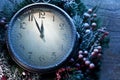 Christmas clock over snow wooden background. Royalty Free Stock Photo