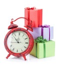 Christmas clock and three gift boxes Royalty Free Stock Photo