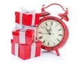 Christmas clock and three gift boxes Royalty Free Stock Photo