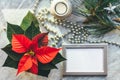 Christmas closeup mockup with poinsettia, pine wreath, notebook, with copy place. Cozy background Royalty Free Stock Photo