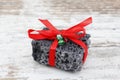 Christmas coal in a wood background
