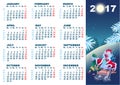 Christmas rolls on sledge from mountain. Blue cartoon Rooster symbol 2017 and wall calendar