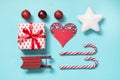 Christmas collection with candy canes, heart, balls, red sleid for mock up template design on blue. Flat lay. Top view. Royalty Free Stock Photo