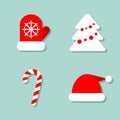 Christmas collection of four icons at blue background: mitten, Christmas tree, candy and Santa`s hat. Vector images