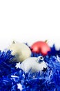 Christmas colored balls in blue tinsel Royalty Free Stock Photo