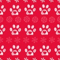 Christmas colored red background colored white paw prints and snowflakes seamless pattern Royalty Free Stock Photo