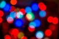 Christmas colorful bright background. Festive abstract bokeh, defocused large colored lights garland red and blue on a Royalty Free Stock Photo