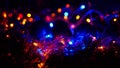 Christmas colorful New Year`s Bokeh neon lights. Abstract Blurred photo background with blinking lights from garlands and balls. D Royalty Free Stock Photo