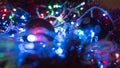 Christmas colorful New Year`s Bokeh neon lights. Abstract Blurred photo background with blinking lights from garlands and balls. D Royalty Free Stock Photo