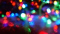 Christmas colorful New Year`s Bokeh neon lights. Abstract Blurred photo background with blinking lights from tangled garlands. Royalty Free Stock Photo