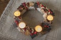 Christmas is coming with Advent. Beautiful closeup of Advent wreath made from natural materials and ceramic decors Royalty Free Stock Photo