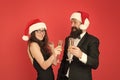 Christmas is coming. xmas party. formal couple in love celebrate new year. tuxedo man with woman in santa hat. merry Royalty Free Stock Photo