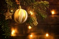 Christmas composition, ball and other decorations on the branches of a Christmas tree on a dark background with lights Royalty Free Stock Photo