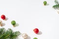 Christmas composition. Balls and fir tree branches on white background. Christmas, winter, new year minimal concept. Side view, Royalty Free Stock Photo