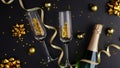 Christmas composition. Black Xmas background with champagne bottle, glasses, golden balls and decorations, confetti. Flat lay, top