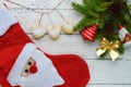 Christmas composition: boots for gifts, decoration fir branch with bright toys, cakes in the form of heart Royalty Free Stock Photo