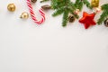 Christmas composition. The border is made of Christmas decoration toys, fir branches, mints on a white background. Flat lay, top v Royalty Free Stock Photo