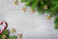 Christmas composition. Christmas candy cane, golden star and fir tree branches. Top view, flat lay Royalty Free Stock Photo