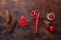 Christmas composition with candy canes, present box and gifts. Red and craft decoration on wooden background Royalty Free Stock Photo