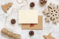 Christmas Composition with a card over sealed envelope flat lay. Holiday mockup